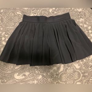 Aritzia TNA Tennis Skirt. Size: medium Color: Dark Grey